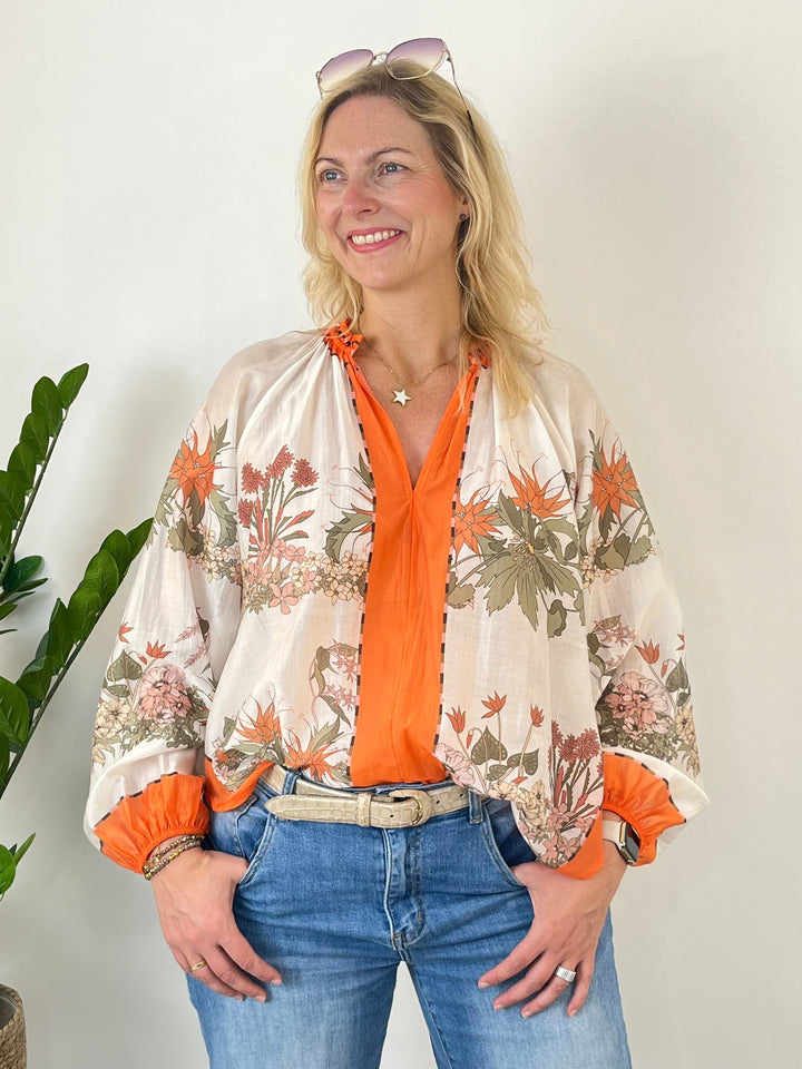 V-Ausschnitt Bluse aus Lyocellmischung mit orangefarbenem Kontrast