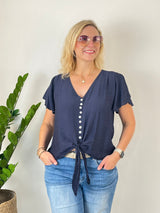 Marineblaue Damenbluse mit Knotendetail am Saum und V-Ausschnitt