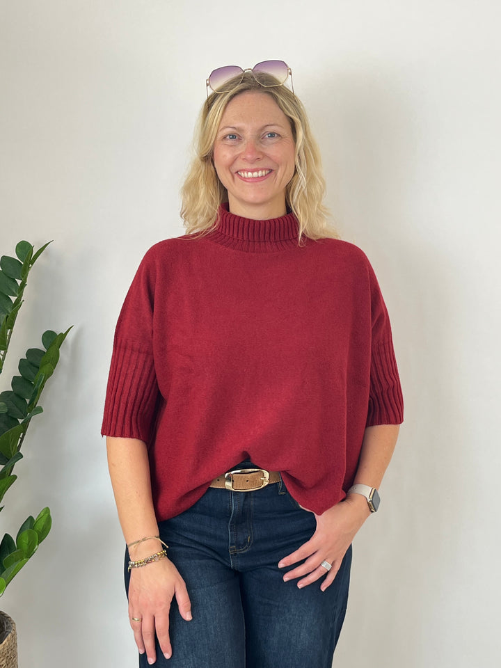 Short-sleeved sweater with stand-up collar