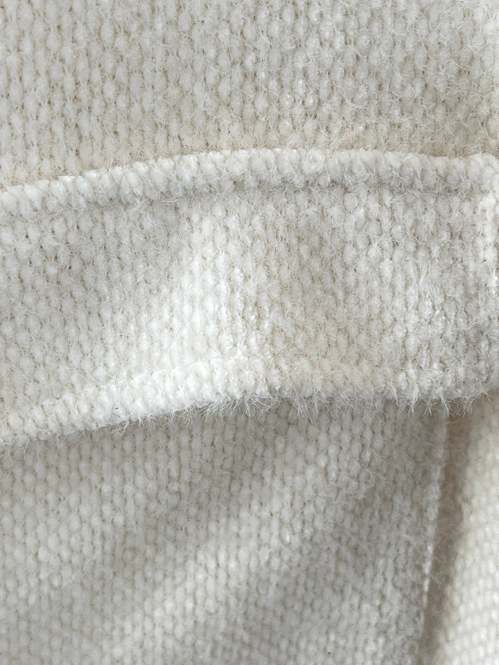 Nahaufnahme texturiertes Material mit Glitzernfäden